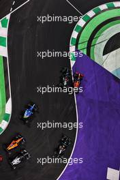 Lewis Hamilton (GBR) Mercedes AMG F1 W12 and Max Verstappen (NLD) Red Bull Racing RB16B battle for the lead at the first restart. 05.12.2021. Formula 1 World Championship, Rd 21, Saudi Arabian Grand Prix, Jeddah, Saudi Arabia, Race Day.