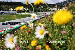 Lewis Hamilton (GBR) Mercedes AMG F1 W12 and Yuki Tsunoda (JPN) AlphaTauri AT02. 25.06.2021. Formula 1 World Championship, Rd 8, Steiermark Grand Prix, Spielberg, Austria, Practice Day.