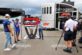 (L to R): George Russell (GBR) Williams Racing and Fernando Alonso (ESP) Alpine F1 Team with Anthony Davidson (GBR) Sky Sports F1 Presenter. 25.06.2021. Formula 1 World Championship, Rd 8, Steiermark Grand Prix, Spielberg, Austria, Practice Day.