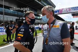 (L to R): Christian Horner (GBR) Red Bull Racing Team Principal with Mario Isola (ITA) Pirelli Racing Manager on the grid. 27.06.2021. Formula 1 World Championship, Rd 8, Steiermark Grand Prix, Spielberg, Austria, Race Day.