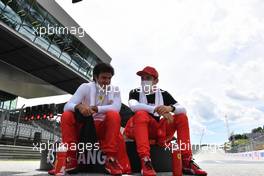 (L to R): Carlos Sainz Jr (ESP) Ferrari and Charles Leclerc (MON) Ferrari on the grid. 27.06.2021. Formula 1 World Championship, Rd 8, Steiermark Grand Prix, Spielberg, Austria, Race Day.