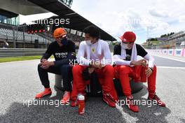 (L to R): Max Verstappen (NLD) Red Bull Racing; Carlos Sainz Jr (ESP) Ferrari and Charles Leclerc (MON) Ferrari on the grid. 27.06.2021. Formula 1 World Championship, Rd 8, Steiermark Grand Prix, Spielberg, Austria, Race Day.