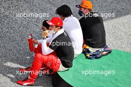 Charles Leclerc (MON) Ferrari with Carlos Sainz Jr (ESP) Ferrari and Max Verstappen (NLD) Red Bull Racing on the grid. 27.06.2021. Formula 1 World Championship, Rd 8, Steiermark Grand Prix, Spielberg, Austria, Race Day.