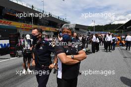 (L to R): Christian Horner (GBR) Red Bull Racing Team Principal and Masashi Yamamoto (JPN) Honda Racing F1 Managing Director on the grid. 27.06.2021. Formula 1 World Championship, Rd 8, Steiermark Grand Prix, Spielberg, Austria, Race Day.