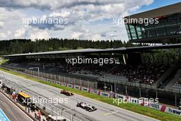 Nikita Mazepin (RUS) Haas F1 Team VF-21 and Max Verstappen (NLD) Red Bull Racing RB16B. 27.06.2021. Formula 1 World Championship, Rd 8, Steiermark Grand Prix, Spielberg, Austria, Race Day.