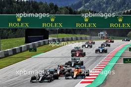 Lewis Hamilton (GBR) Mercedes AMG F1 W12 leads Lando Norris (GBR) McLaren MCL35M and Sergio Perez (MEX) Red Bull Racing RB16B at the start of the race. 27.06.2021. Formula 1 World Championship, Rd 8, Steiermark Grand Prix, Spielberg, Austria, Race Day.