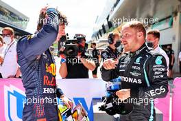 (L to R): Pole sitter Max Verstappen (NLD) Red Bull Racing with Valtteri Bottas (FIN) Mercedes AMG F1 in qualifying parc ferme. 26.06.2021. Formula 1 World Championship, Rd 8, Steiermark Grand Prix, Spielberg, Austria, Qualifying Day.