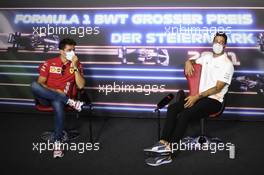 (L to R): Charles Leclerc (MON) Ferrari and Daniel Ricciardo (AUS) McLaren in the FIA Press Conference. 24.06.2021. Formula 1 World Championship, Rd 8, Steiermark Grand Prix, Spielberg, Austria, Preparation Day.