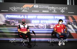 (L to R): Kimi Raikkonen (FIN) Alfa Romeo Racing and Carlos Sainz Jr (ESP) Ferrari in the FIA Press Conference. 24.06.2021. Formula 1 World Championship, Rd 8, Steiermark Grand Prix, Spielberg, Austria, Preparation Day.