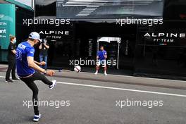 Esteban Ocon (FRA) Alpine F1 Team plays football in the paddock with team mate Fernando Alonso (ESP) Alpine F1 Team. 24.06.2021. Formula 1 World Championship, Rd 8, Steiermark Grand Prix, Spielberg, Austria, Preparation Day.