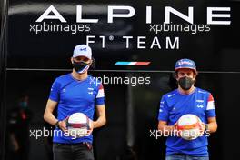 (L to R): Esteban Ocon (FRA) Alpine F1 Team plays football in the paddock with team mate Fernando Alonso (ESP) Alpine F1 Team. 24.06.2021. Formula 1 World Championship, Rd 8, Steiermark Grand Prix, Spielberg, Austria, Preparation Day.