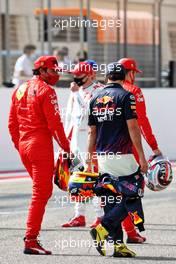 (L to R): Carlos Sainz Jr (ESP) Ferrari and Sergio Perez (MEX) Red Bull Racing. 12.03.2021. Formula 1 Testing, Sakhir, Bahrain, Day One.