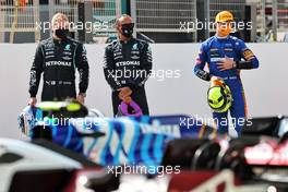 (L to R): Valtteri Bottas (FIN) Mercedes AMG F1; Lewis Hamilton (GBR) Mercedes AMG F1; and Lando Norris (GBR) McLaren. 12.03.2021. Formula 1 Testing, Sakhir, Bahrain, Day One.