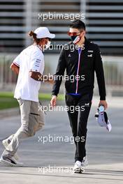 Esteban Ocon (FRA) Alpine F1 Team and Lewis Hamilton (GBR) Mercedes AMG F1. 12.03.2021. Formula 1 Testing, Sakhir, Bahrain, Day One.