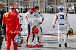 Nikita Mazepin (RUS) Haas F1 Team; Pierre Gasly (FRA) AlphaTauri, and Mick Schumacher (GER) Haas F1 Team. 12.03.2021. Formula 1 Testing, Sakhir, Bahrain, Day One.