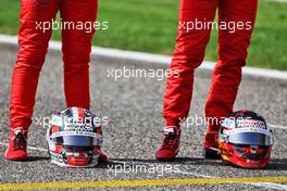 (L to R): The helmets of Charles Leclerc (MON) Ferrari and Carlos Sainz Jr (ESP) Ferrari.  12.03.2021. Formula 1 Testing, Sakhir, Bahrain, Day One.