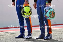 (L to R): the helmets of Lando Norris (GBR) McLaren and Daniel Ricciardo (AUS) McLaren. 12.03.2021. Formula 1 Testing, Sakhir, Bahrain, Day One.