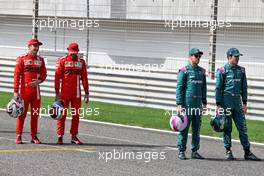 Charles Leclerc (MON) Ferrari and Carlos Sainz Jr (ESP) Ferrari with Sebastian Vettel (GER) Aston Martin F1 Team and Lance Stroll (CDN) Aston Martin F1 Team. 12.03.2021. Formula 1 Testing, Sakhir, Bahrain, Day One.