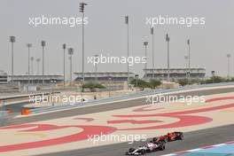 Antonio Giovinazzi (ITA) Alfa Romeo Racing C41 and Carlos Sainz Jr (ESP) Ferrari SF-21. 13.03.2021. Formula 1 Testing, Sakhir, Bahrain, Day Two.