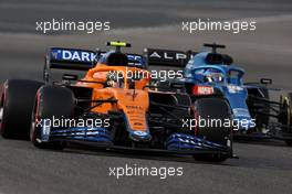 Lando Norris (GBR), McLaren F1 Team and Fernando Alonso (ESP), Alpine F1 Team  13.03.2021. Formula 1 Testing, Sakhir, Bahrain, Day Two.