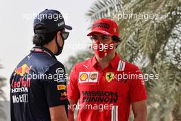 (L to R): Sergio Perez (MEX) Red Bull Racing with Carlos Sainz Jr (ESP) Ferrari. 13.03.2021. Formula 1 Testing, Sakhir, Bahrain, Day Two.