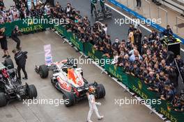 Sergio Perez (MEX) Red Bull Racing celebrates his third position with the team in parc ferme. 10.10.2021. Formula 1 World Championship, Rd 16, Turkish Grand Prix, Istanbul, Turkey, Race Day.