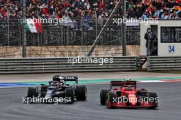 Carlos Sainz Jr (ESP) Ferrari SF-21 and Yuki Tsunoda (JPN) AlphaTauri AT02 battle for position. 10.10.2021. Formula 1 World Championship, Rd 16, Turkish Grand Prix, Istanbul, Turkey, Race Day.