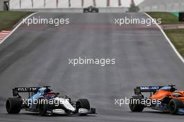 George Russell (GBR) Williams Racing FW43B and Daniel Ricciardo (AUS) McLaren MCL35M. 10.10.2021. Formula 1 World Championship, Rd 16, Turkish Grand Prix, Istanbul, Turkey, Race Day.