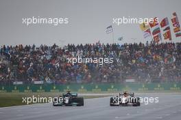 Lewis Hamilton (GBR) Mercedes AMG F1 W12 and Sergio Perez (MEX) Red Bull Racing RB16B battle for position. 10.10.2021. Formula 1 World Championship, Rd 16, Turkish Grand Prix, Istanbul, Turkey, Race Day.