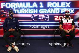 (L to R): George Russell (GBR) Williams Racing anbd Kimi Raikkonen (FIN) Alfa Romeo Racing in the FIA Press Conference. 07.10.2021. Formula 1 World Championship, Rd 16, Turkish Grand Prix, Istanbul, Turkey, Preparation Day.