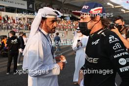 Fernando Alonso (ESP) Alpine F1 Team A521 with Mohammed Bin Sulayem (UAE) FIA Presidential Candidate. 12.12.2021. Formula 1 World Championship, Rd 22, Abu Dhabi Grand Prix, Yas Marina Circuit, Abu Dhabi, Race Day.