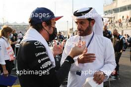 Fernando Alonso (ESP) Alpine F1 Team A521 with Mohammed Bin Sulayem (UAE) FIA Presidential Candidate. 12.12.2021. Formula 1 World Championship, Rd 22, Abu Dhabi Grand Prix, Yas Marina Circuit, Abu Dhabi, Race Day.