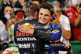 (L to R): Race winner and World Champion Max Verstappen (NLD) Red Bull Racing celebrates in parc ferme with Lando Norris (GBR) McLaren. 12.12.2021. Formula 1 World Championship, Rd 22, Abu Dhabi Grand Prix, Yas Marina Circuit, Abu Dhabi, Race Day.