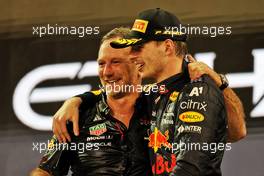 (L to R): Christian Horner (GBR) Red Bull Racing Team Principal celebrates on the podium with race winner and World Champion Max Verstappen (NLD) Red Bull Racing. 12.12.2021. Formula 1 World Championship, Rd 22, Abu Dhabi Grand Prix, Yas Marina Circuit, Abu Dhabi, Race Day.