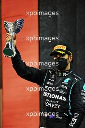 Second placed Lewis Hamilton (GBR) Mercedes AMG F1 celebrates on the podium. 12.12.2021. Formula 1 World Championship, Rd 22, Abu Dhabi Grand Prix, Yas Marina Circuit, Abu Dhabi, Race Day.