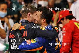 (L to R): Race winner and World Champion Max Verstappen (NLD) Red Bull Racing celebrates in parc ferme with Daniel Ricciardo (AUS) McLaren. 12.12.2021. Formula 1 World Championship, Rd 22, Abu Dhabi Grand Prix, Yas Marina Circuit, Abu Dhabi, Race Day.