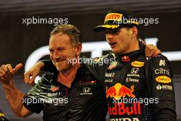 (L to R): Christian Horner (GBR) Red Bull Racing Team Principal celebrates on the podium with race winner and World Champion Max Verstappen (NLD) Red Bull Racing. 12.12.2021. Formula 1 World Championship, Rd 22, Abu Dhabi Grand Prix, Yas Marina Circuit, Abu Dhabi, Race Day.