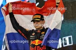 Race winner and World Champion Max Verstappen (NLD) Red Bull Racing celebrates on the podium. 12.12.2021. Formula 1 World Championship, Rd 22, Abu Dhabi Grand Prix, Yas Marina Circuit, Abu Dhabi, Race Day.