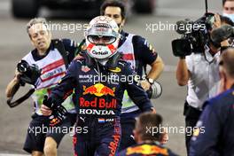 Race winner and World Champion Max Verstappen (NLD) Red Bull Racing celebrates in parc ferme. 12.12.2021. Formula 1 World Championship, Rd 22, Abu Dhabi Grand Prix, Yas Marina Circuit, Abu Dhabi, Race Day.