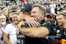 1st place and new World Champion, Max Verstappen (NLD) Red Bull Racing RB16B and Christian Horner (GBR) Red Bull Racing Team Principal. 12.12.2021. Formula 1 World Championship, Rd 22, Abu Dhabi Grand Prix, Yas Marina Circuit, Abu Dhabi, Race Day.