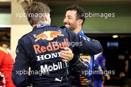 1st place and new World Champion, Max Verstappen (NLD) Red Bull Racing RB16B and Daniel Ricciardo (AUS) McLaren MCL35M. 12.12.2021. Formula 1 World Championship, Rd 22, Abu Dhabi Grand Prix, Yas Marina Circuit, Abu Dhabi, Race Day.