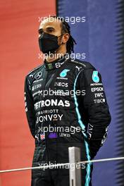 Second placed Lewis Hamilton (GBR) Mercedes AMG F1 on the podium. 12.12.2021. Formula 1 World Championship, Rd 22, Abu Dhabi Grand Prix, Yas Marina Circuit, Abu Dhabi, Race Day.