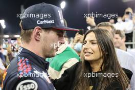 1st place and new World Champion, Max Verstappen (NLD) Red Bull Racing RB16B with  Kelly Piquet (BRA) with her boyfriend Max Verstappen (NLD) Red Bull Racing. 12.12.2021. Formula 1 World Championship, Rd 22, Abu Dhabi Grand Prix, Yas Marina Circuit, Abu Dhabi, Race Day.