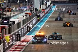 Lewis Hamilton (GBR) Mercedes AMG F1 W12 leads behind the Aston Martin FIA Safety Car. 12.12.2021. Formula 1 World Championship, Rd 22, Abu Dhabi Grand Prix, Yas Marina Circuit, Abu Dhabi, Race Day.