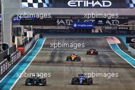 Lewis Hamilton (GBR) Mercedes AMG F1 W12 and Esteban Ocon (FRA) Alpine F1 Team A521. 12.12.2021. Formula 1 World Championship, Rd 22, Abu Dhabi Grand Prix, Yas Marina Circuit, Abu Dhabi, Race Day.