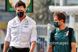 (L to R): Toto Wolff (GER) Mercedes AMG F1 Shareholder and Executive Director with Sebastian Vettel (GER) Aston Martin F1 Team. 11.12.2021. Formula 1 World Championship, Rd 22, Abu Dhabi Grand Prix, Yas Marina Circuit, Abu Dhabi, Qualifying Day.
