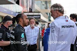 (L to R): Lewis Hamilton (GBR) Mercedes AMG F1 with Jim Ratcliffe (GBR) Chief Executive Officer of Ineos / Mercedes AMG F1 Shareholder at a team photograph. 12.12.2021. Formula 1 World Championship, Rd 22, Abu Dhabi Grand Prix, Yas Marina Circuit, Abu Dhabi, Race Day.