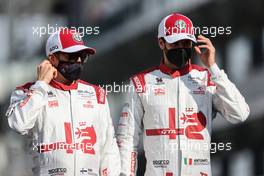 Kimi Raikkonen (FIN), Alfa Romeo Racing and Antonio Giovinazzi (ITA), Alfa Romeo Racing  12.12.2021. Formula 1 World Championship, Rd 22, Abu Dhabi Grand Prix, Yas Marina Circuit, Abu Dhabi, Race Day.