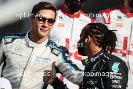 Lewis Hamilton (GBR), Mercedes AMG F1  and George Russell (GBR), Williams Racing  12.12.2021. Formula 1 World Championship, Rd 22, Abu Dhabi Grand Prix, Yas Marina Circuit, Abu Dhabi, Race Day.