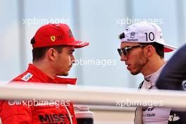 (L to R): Charles Leclerc (MON) Ferrari and Pierre Gasly (FRA) AlphaTauri on the drivers parade. 12.12.2021. Formula 1 World Championship, Rd 22, Abu Dhabi Grand Prix, Yas Marina Circuit, Abu Dhabi, Race Day.